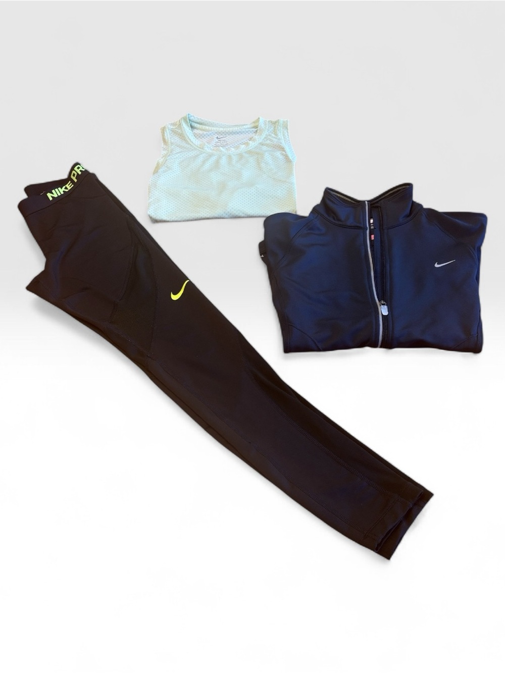 NikeFit Women’s Athletic Jacket outfit, with a  top and  leggings.